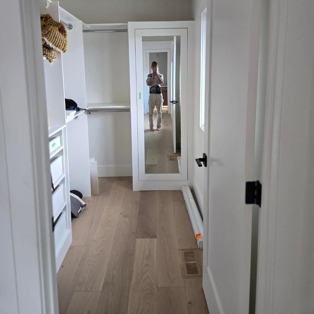 White hallway and walk-in closet interior painting in Tuscany, Calgary White hallway and walk-in closet interior painting in Tuscany, Calgary