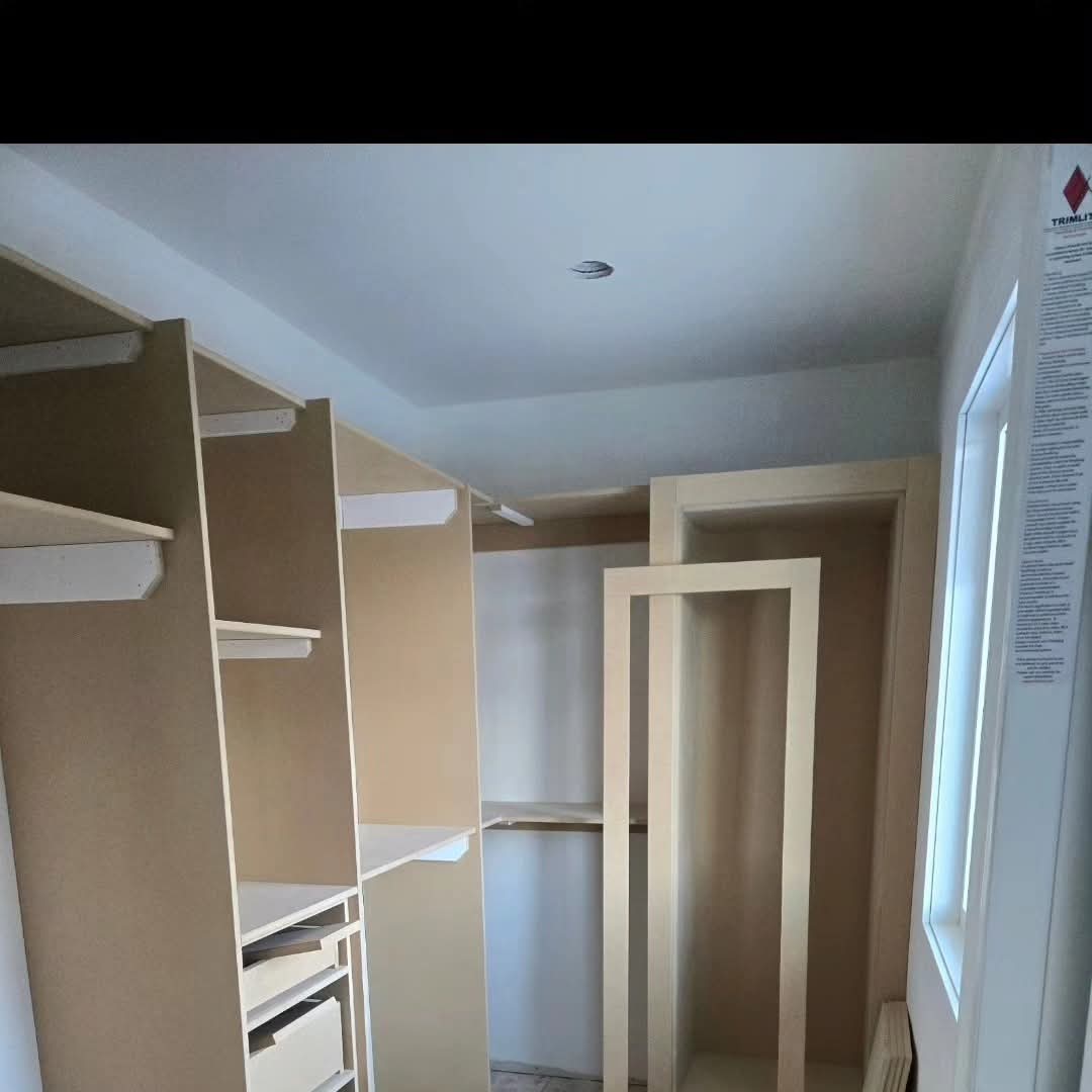 New built-in closet prepped and primed for finish paint in Cranston, Calgary New built-in closet prepped and primed for finish paint in Cranston, Calgary