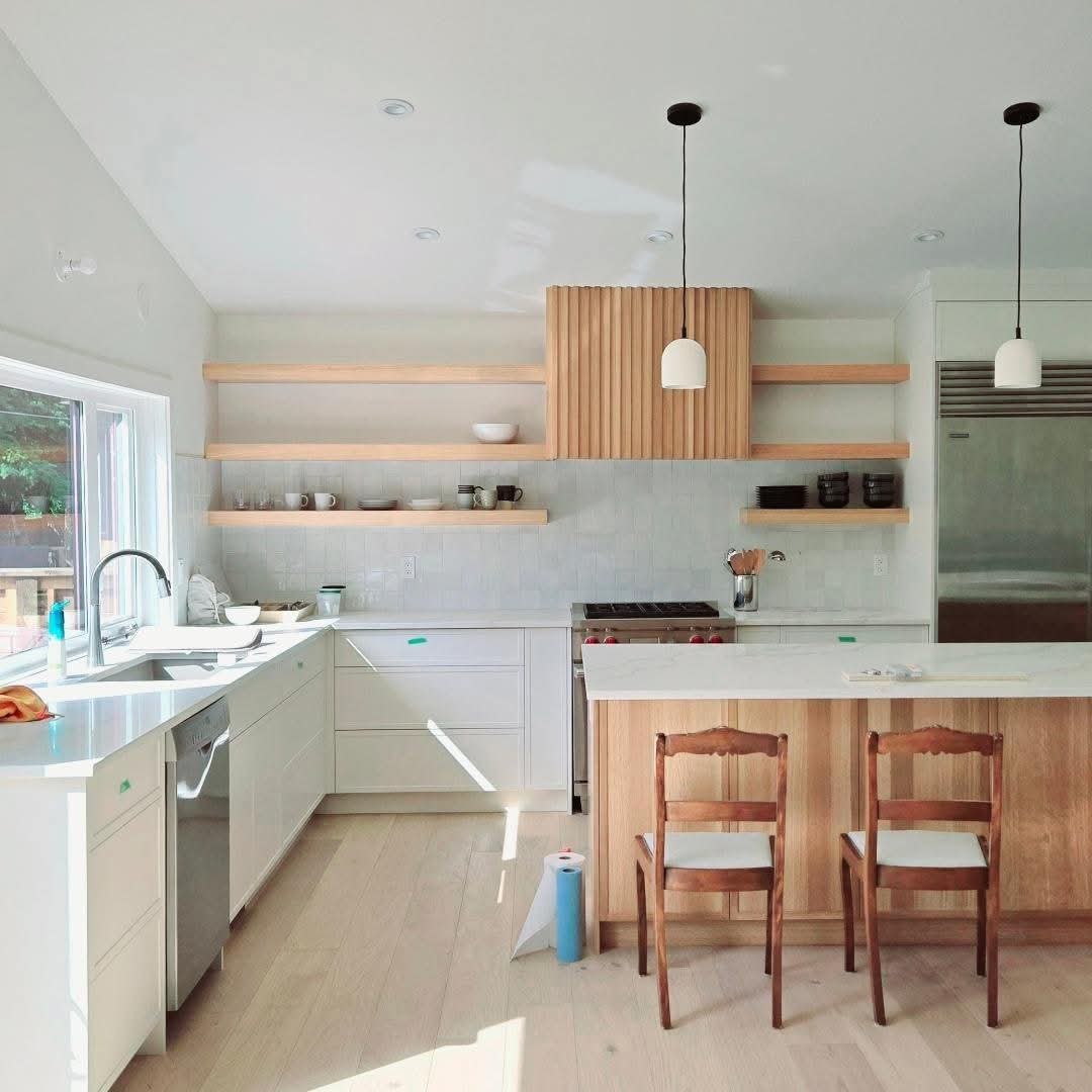 Modern kitchen with freshly painted white cabinets and trim in Bridgeland, Calgary Modern kitchen with freshly painted white cabinets and trim in Bridgeland, Calgary